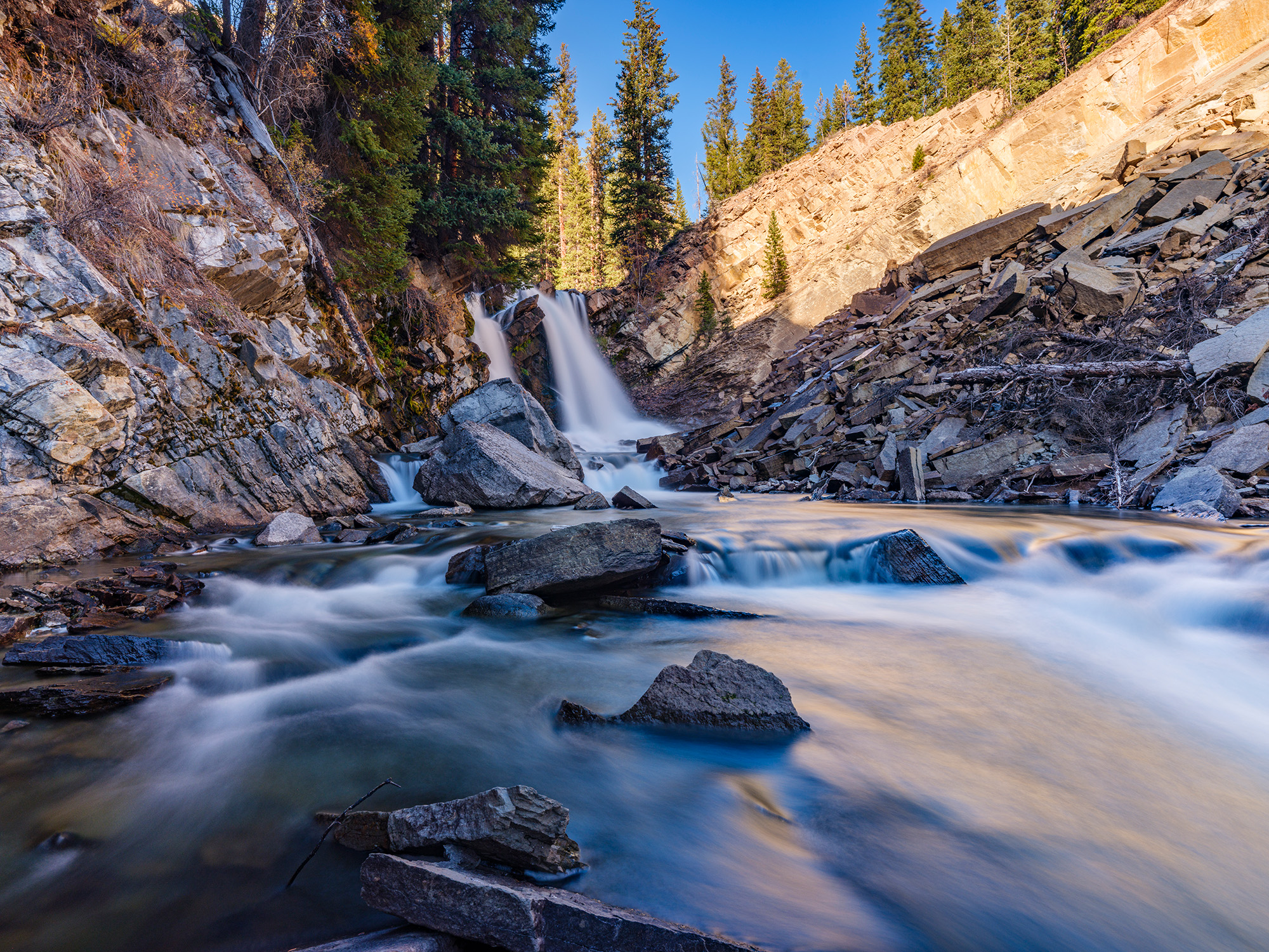 Clear Creek Falls is a thundering cascade that drops over a cliff into a small canyon just before the confluence of Clear Creek...