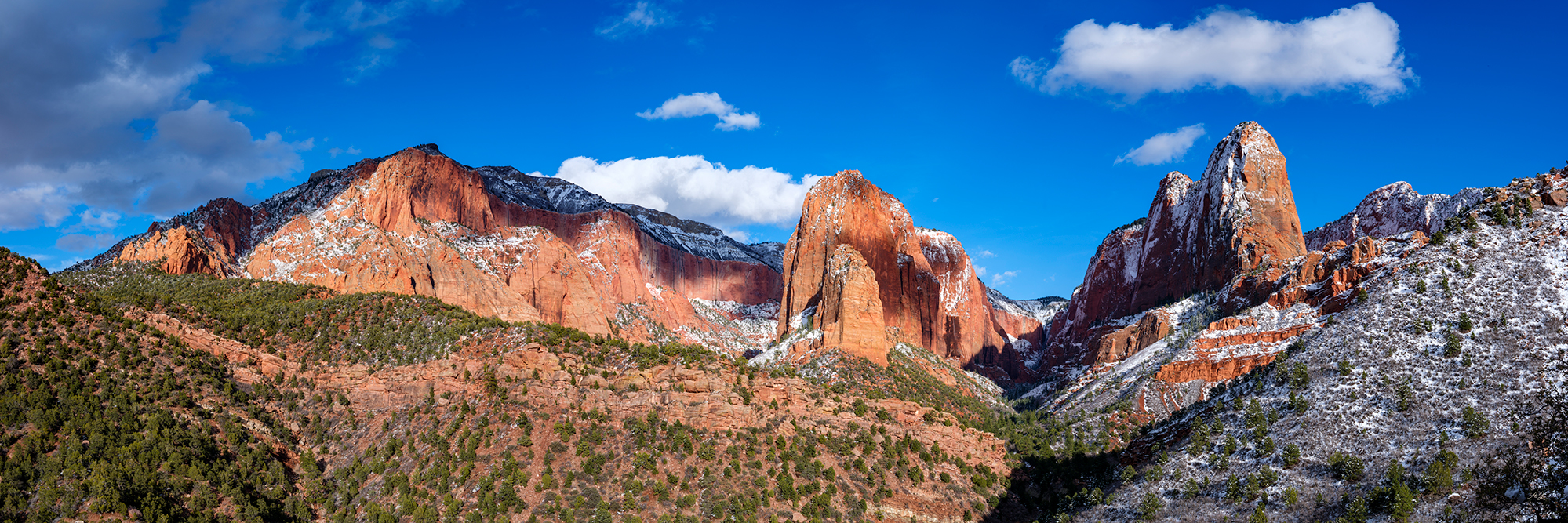 Light and shadows, snow and red cliffs all combine to create this spectacular view up Kolob Canyon in Zion National Park, Utah...