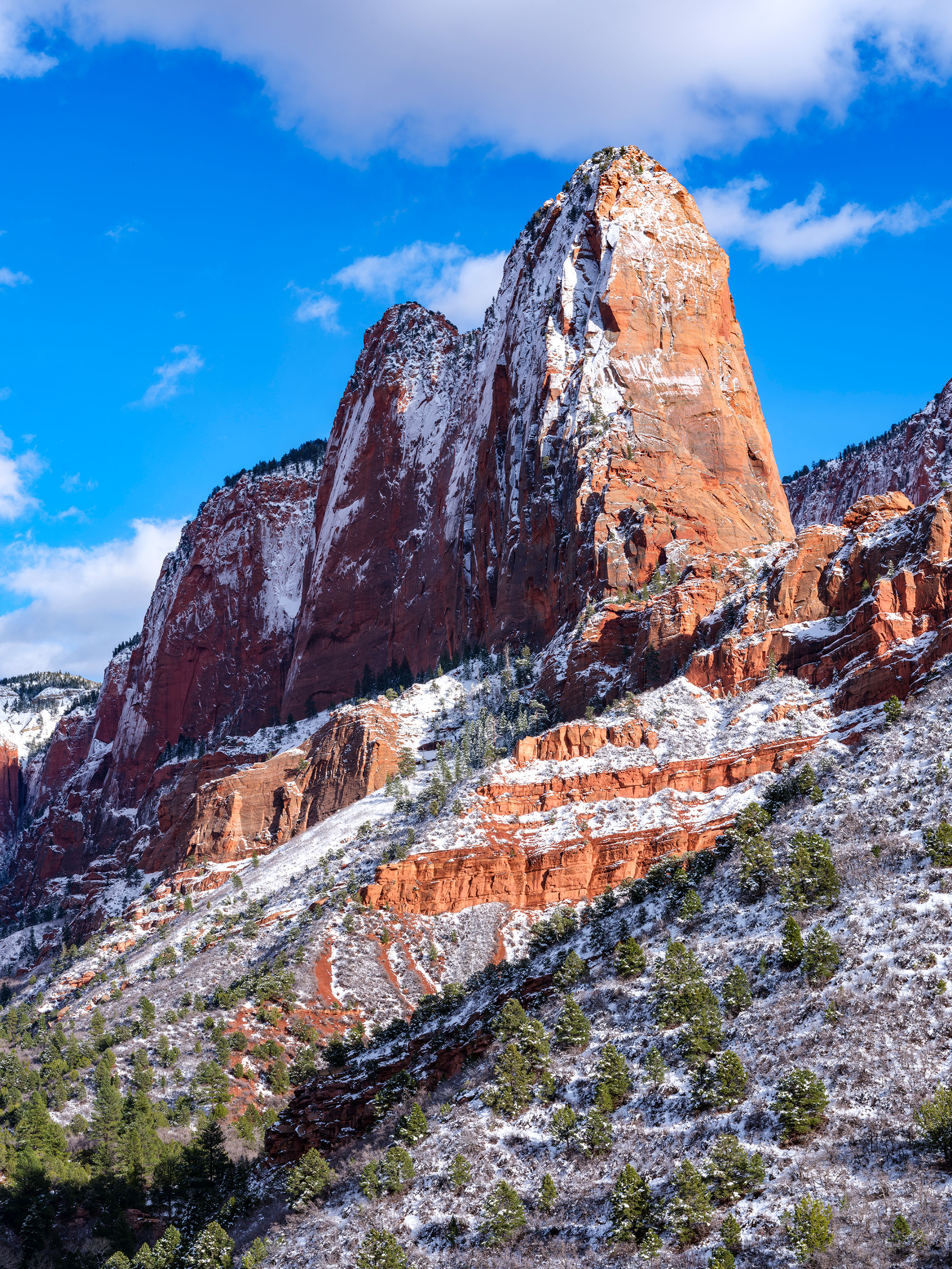 Paria Point stands out on this early spring evening with the spectacular contrast of fresh snow against the red sandstone cliffs...